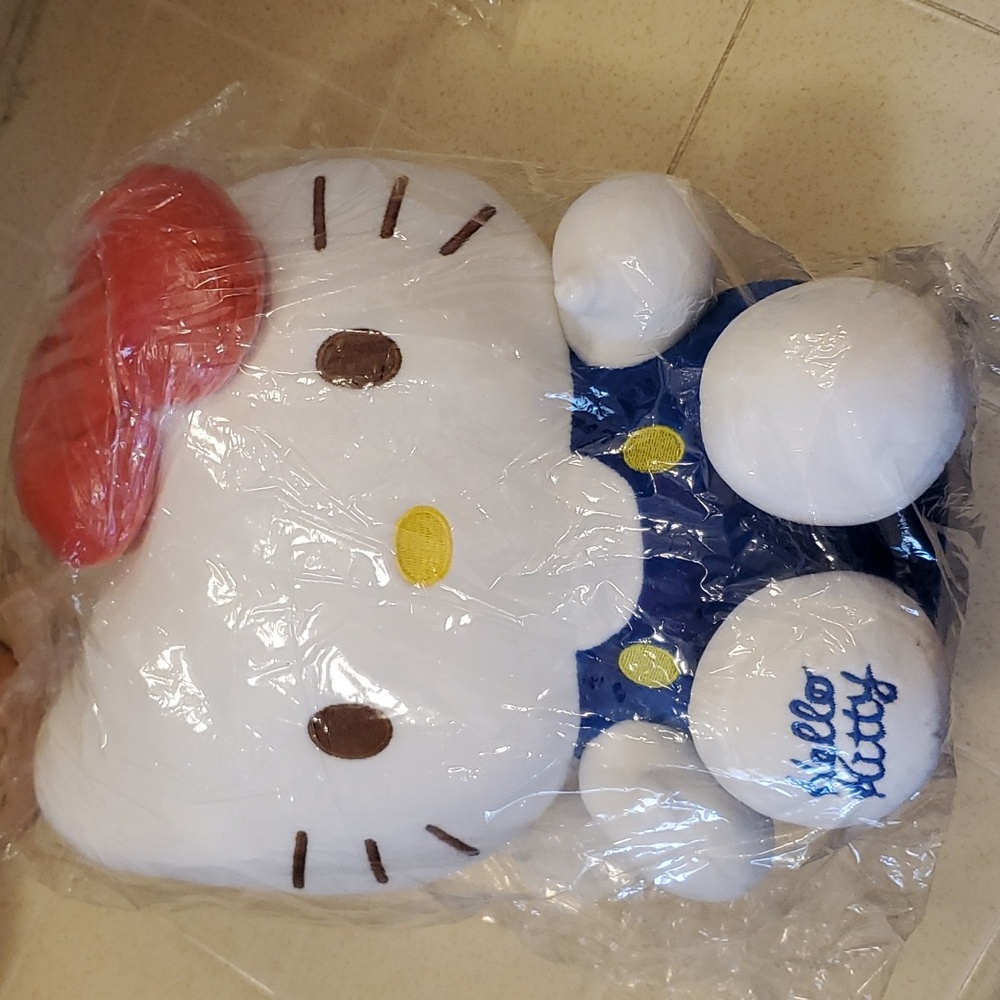 Hello Kitty plush stuffed animal with blue outfit and red bow New